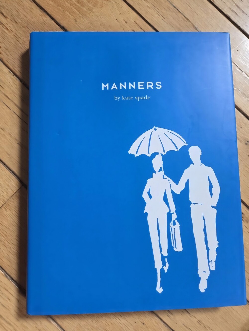 Kate Spade Manners Blue Hardcover Book with White Silhouette